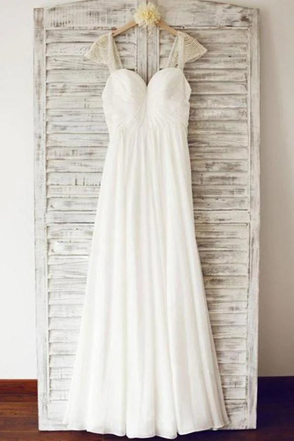 Elegant A-line chiffon wedding dress with cap sleeves and beading.
