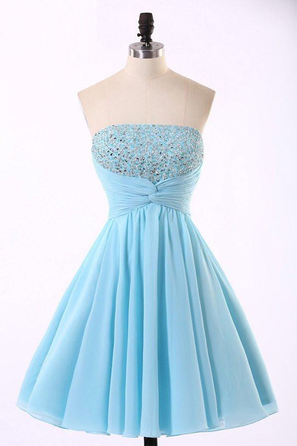 Model wearing a light blue A-line chiffon homecoming dress.