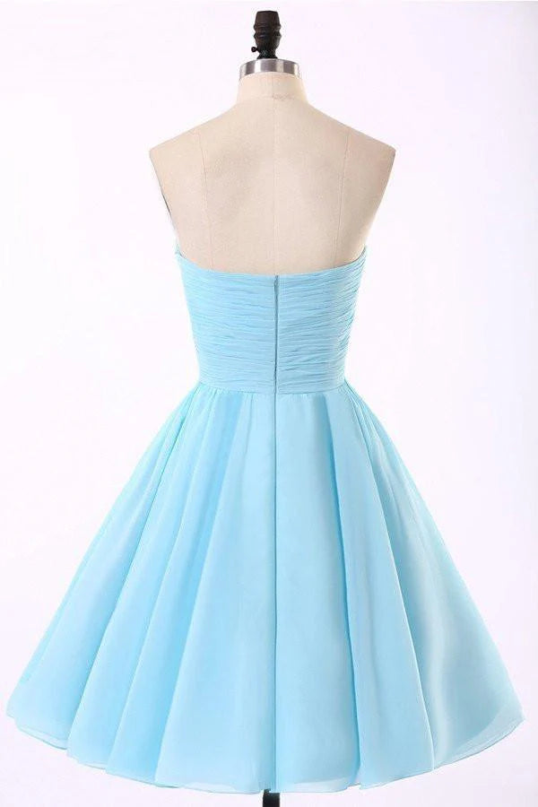 Light blue A-line chiffon dress with flowing skirt.