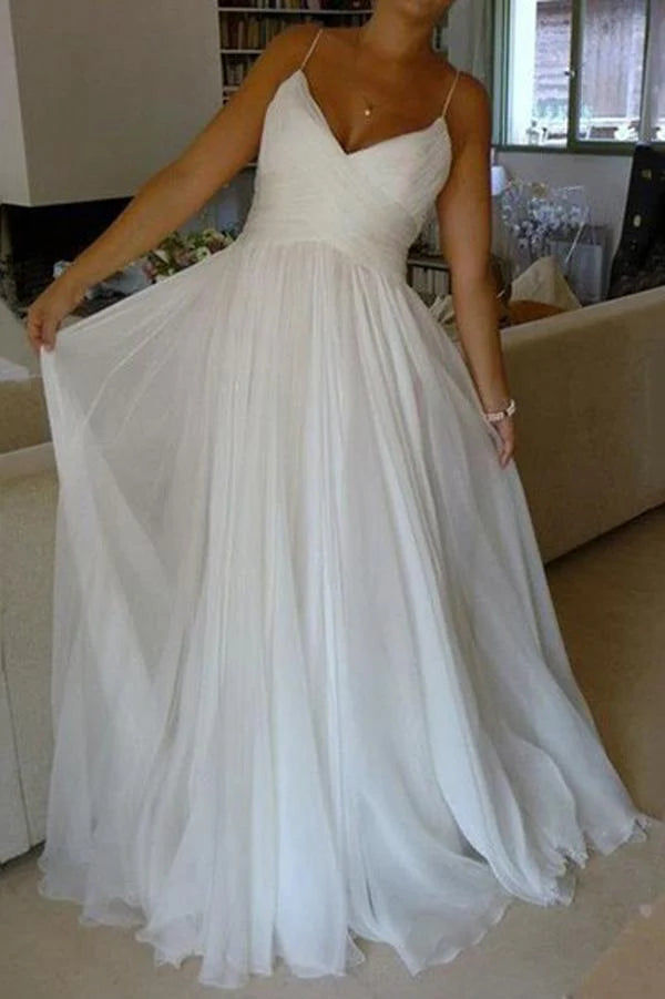Elegant A-line chiffon wedding dress with V-neck and spaghetti straps.