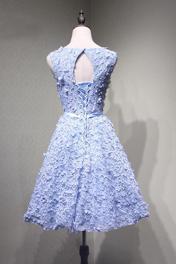 Back view of the blue lace homecoming dress, showcasing the open back design.