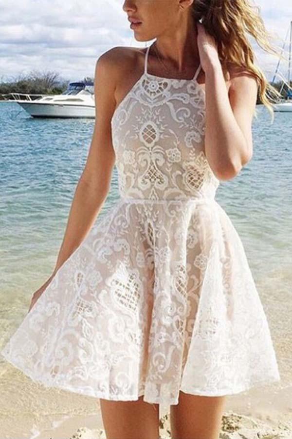 Ivory A-line lace homecoming dress with criss-cross straps.