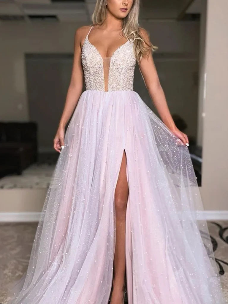 Model wearing an elegant A-line deep V-neck backless beaded long prom dress.