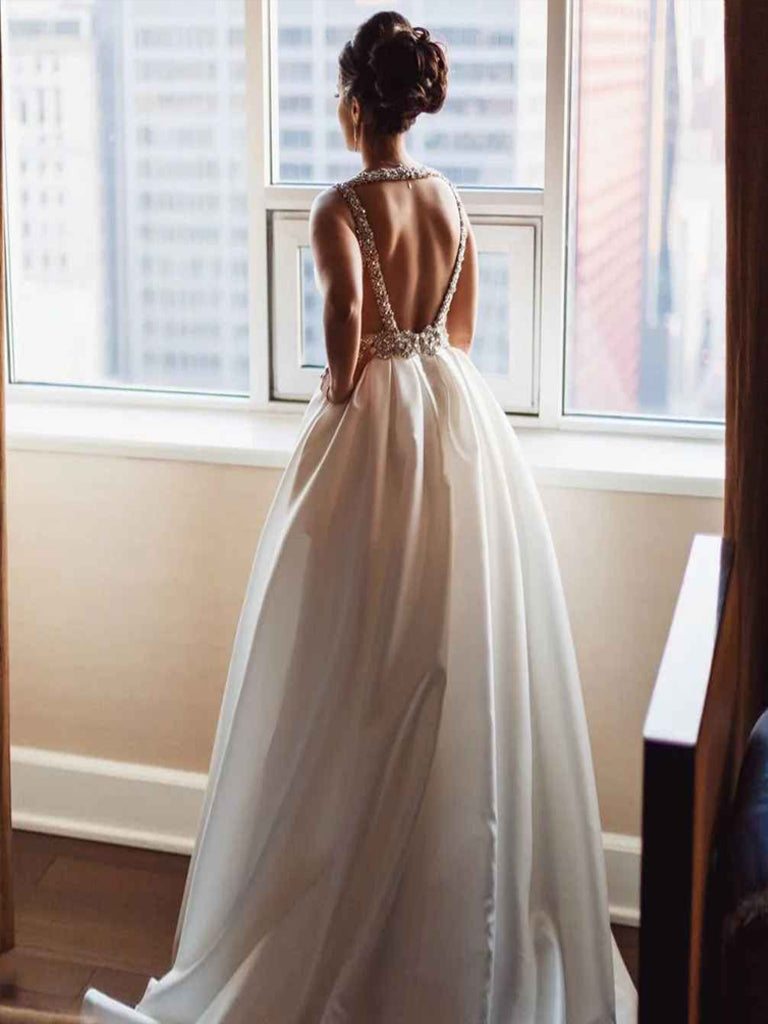 Back view of the A-line deep V-neck backless satin formal dress, showcasing the sweep train and beaded details.