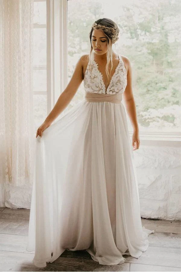 Back view of the A-line wedding dress showcasing the criss-cross detail and waistband.