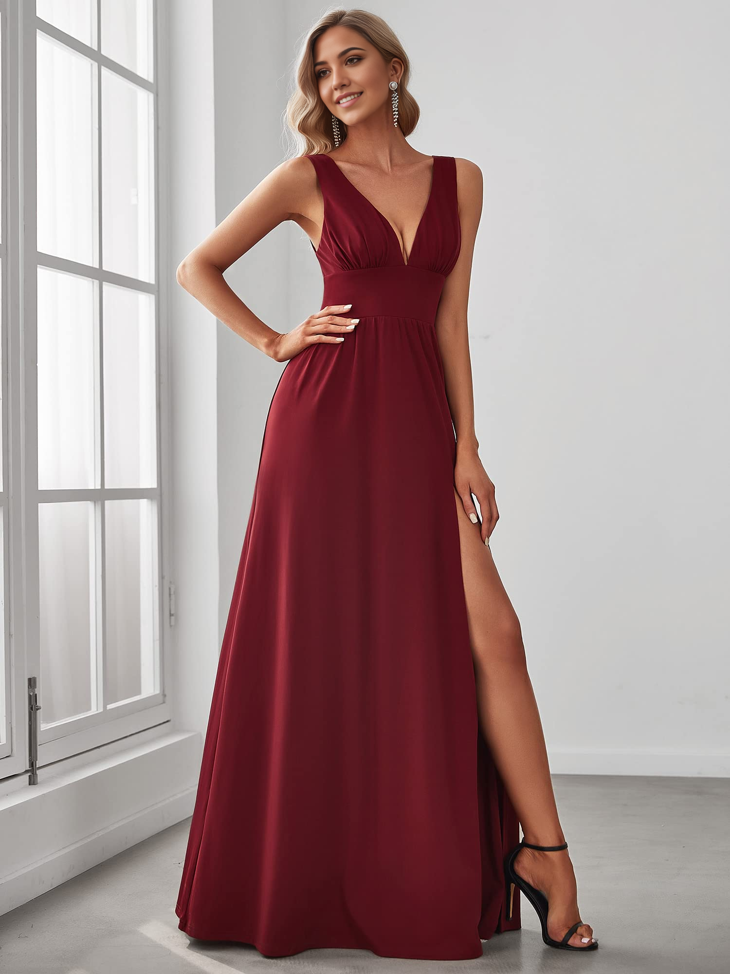 Elegant A-line deep V-neck sleeveless gown with side slit.