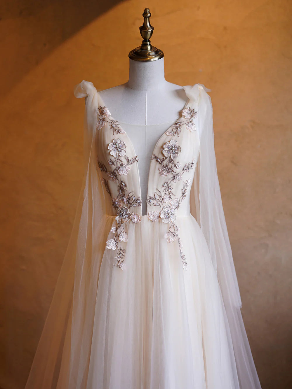 Full length view of the elegant deep V-neck prom gown.