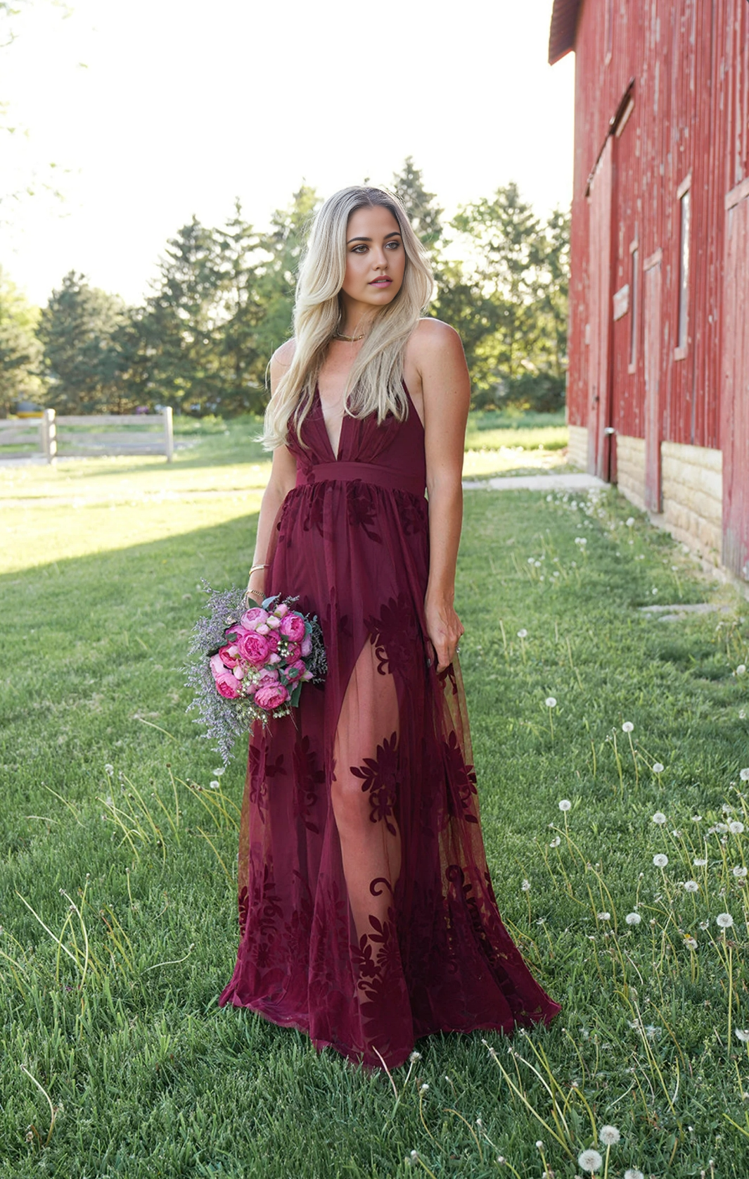 Woman wearing an elegant A-line deep V spaghetti strap formal dress.