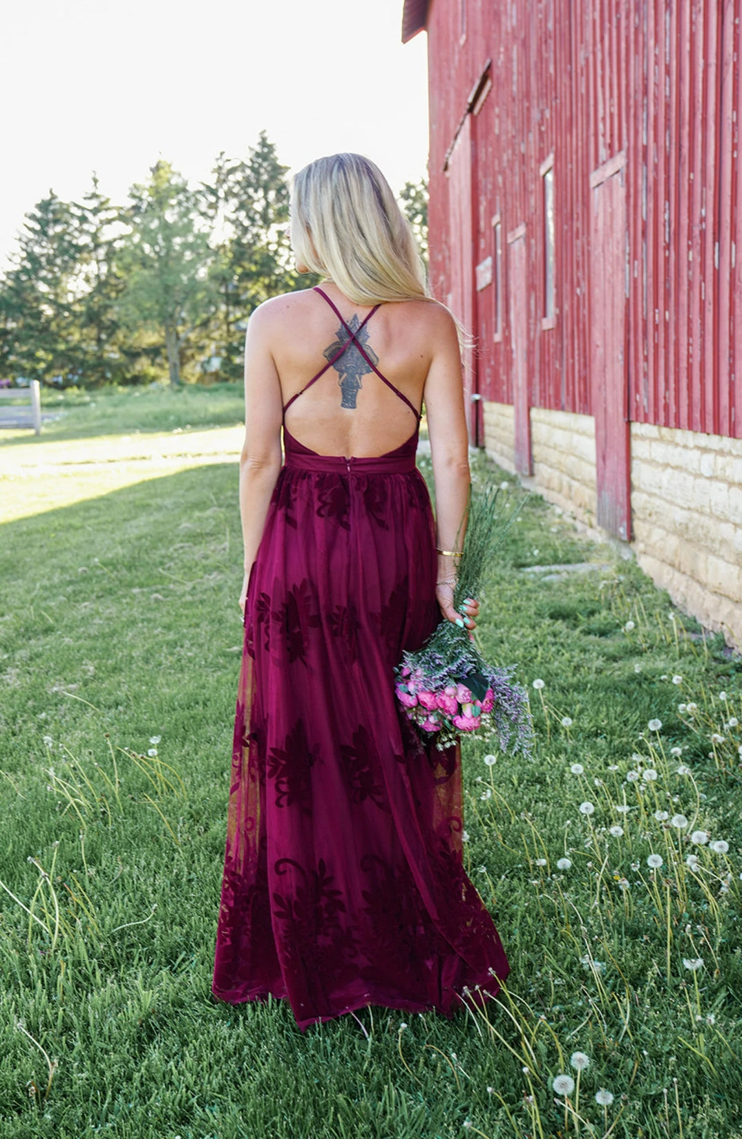 Model showcasing the A-line deep V spaghetti strap bridesmaid dress.