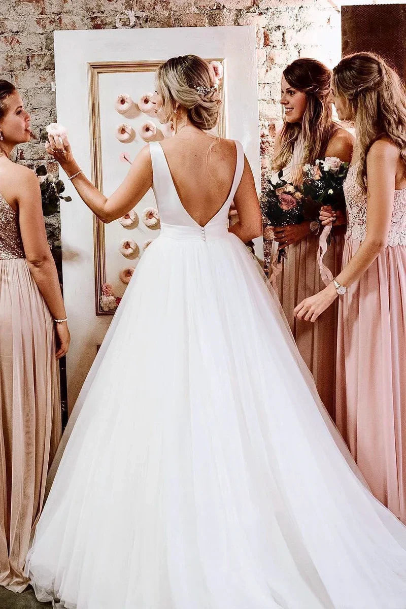 Back view of the A-line wedding dress showing a deep V-back and bow.