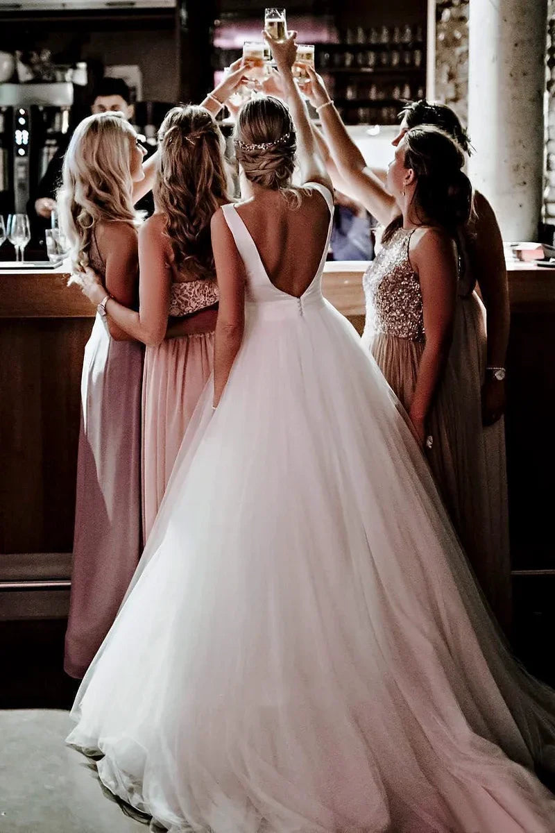 Close-up of the delicate tulle skirt and bow detail on the wedding dress.