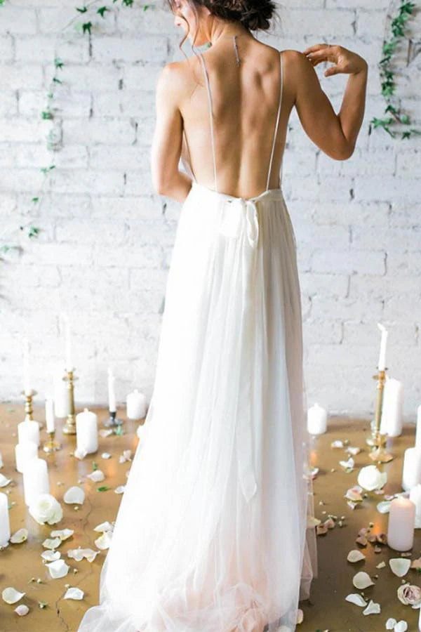 Back view of the A-line ivory wedding dress, showcasing the sweep train and strap details.