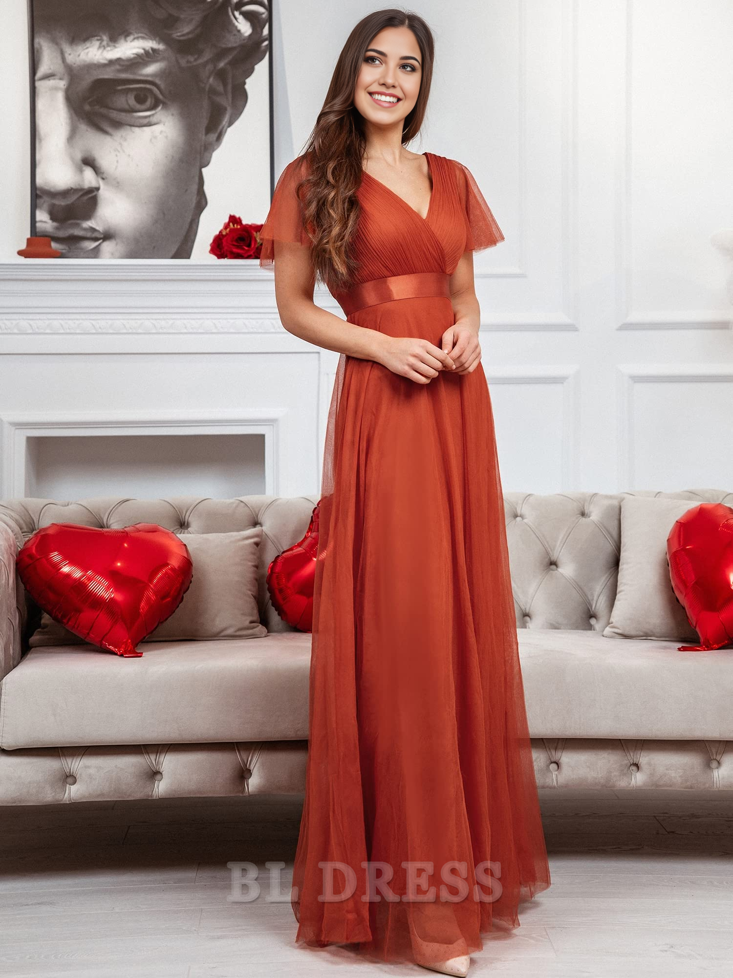 Side profile of the A-line empire waist tulle dress.