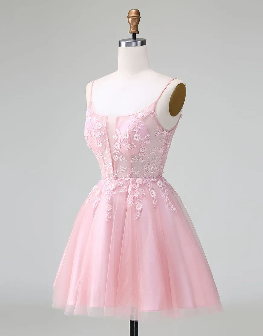 Close-up of the glitter and floral details on a formal A-line dress.