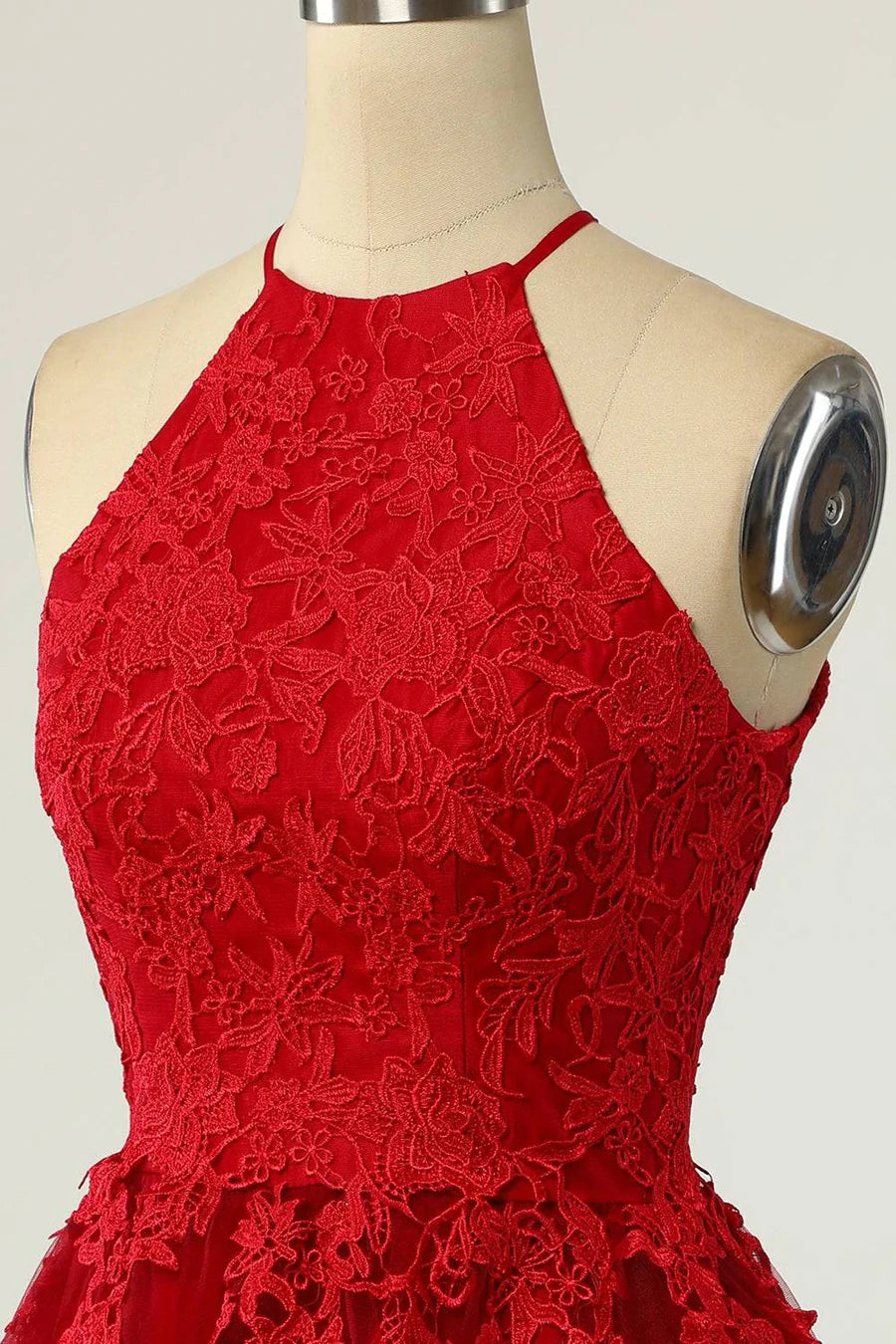 Close-up of delicate applique on the A-line halter dress.