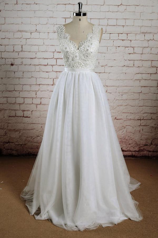 Elegant A-line tulle lace wedding dress with halter V-neck and sweep train.