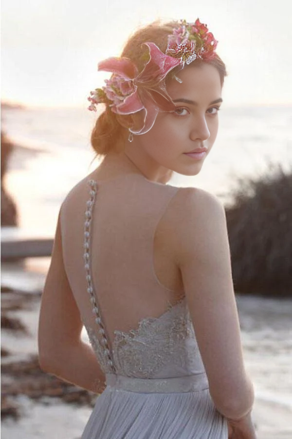 Bride wearing a romantic A-line wedding dress with flowing chiffon skirt.