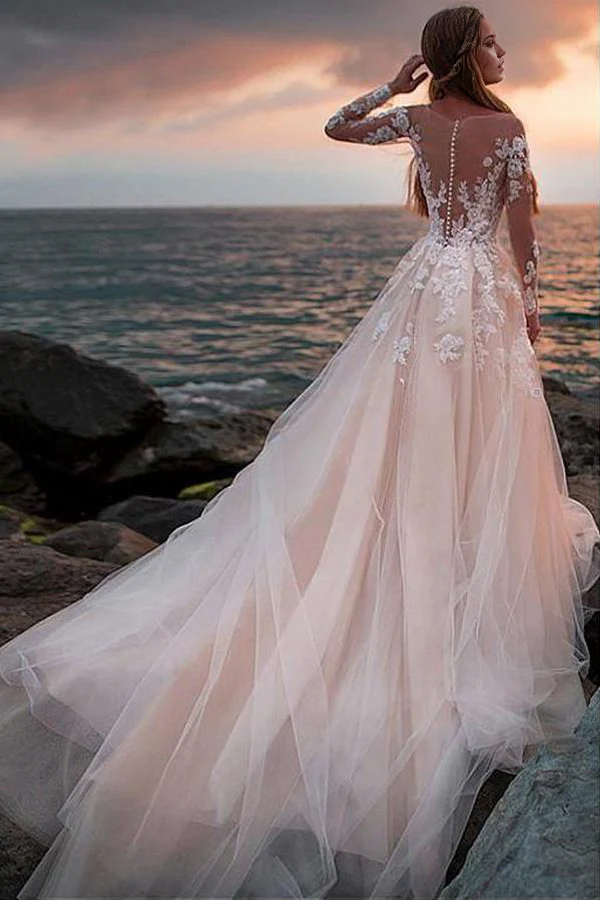 Back view of the ivory A-line wedding dress, showcasing delicate lace details on the sleeves.