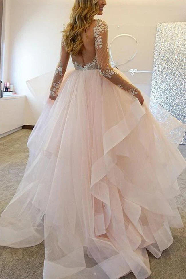 Bridal dress featuring intricate lace details and a flowing A-line skirt.