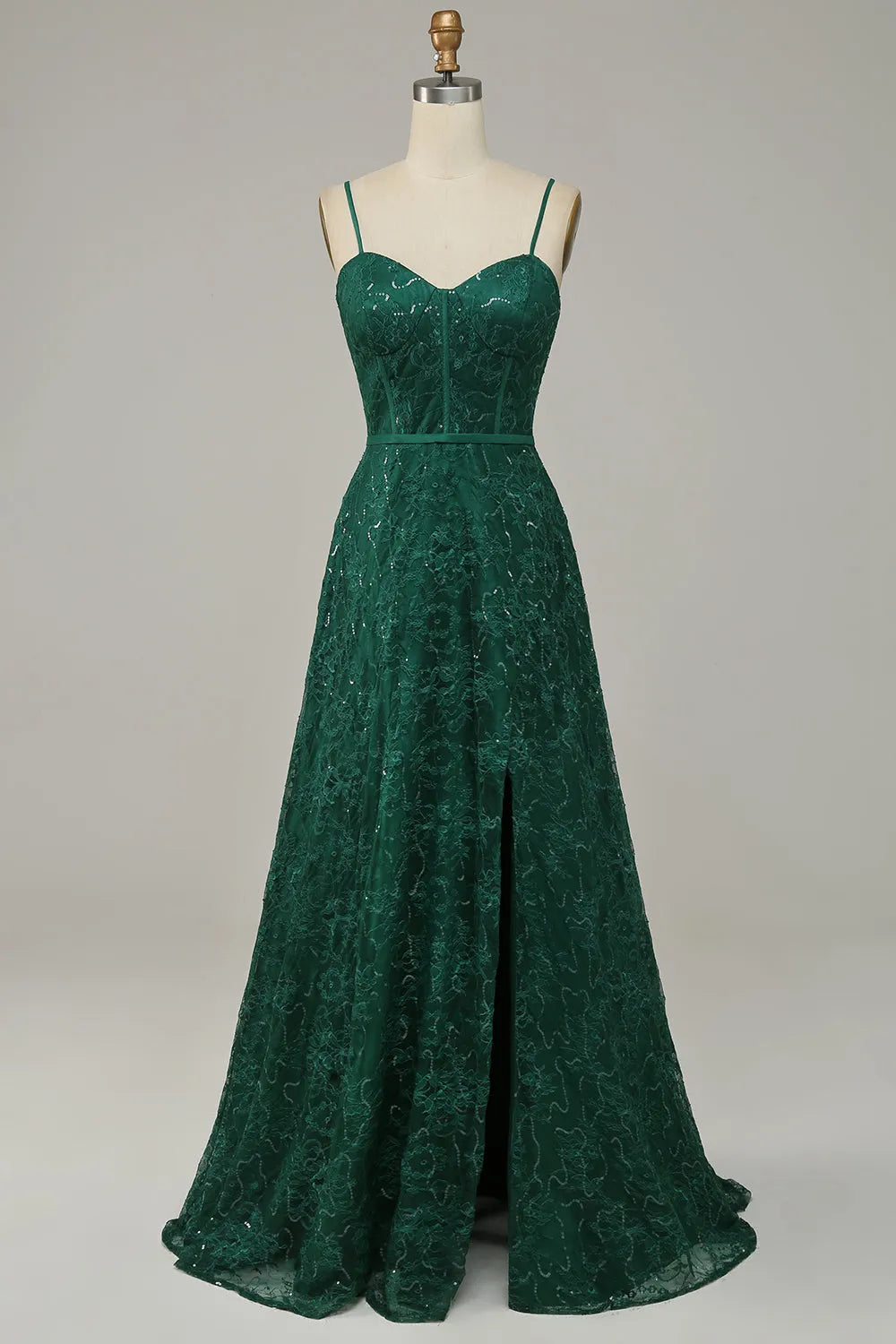 Model wearing an elegant A-line lace prom dress with spaghetti straps and a V-neckline.