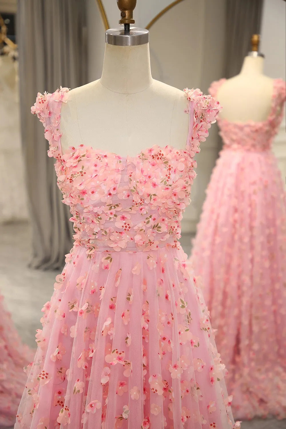 Close-up of 3D floral embellishments on the prom dress.