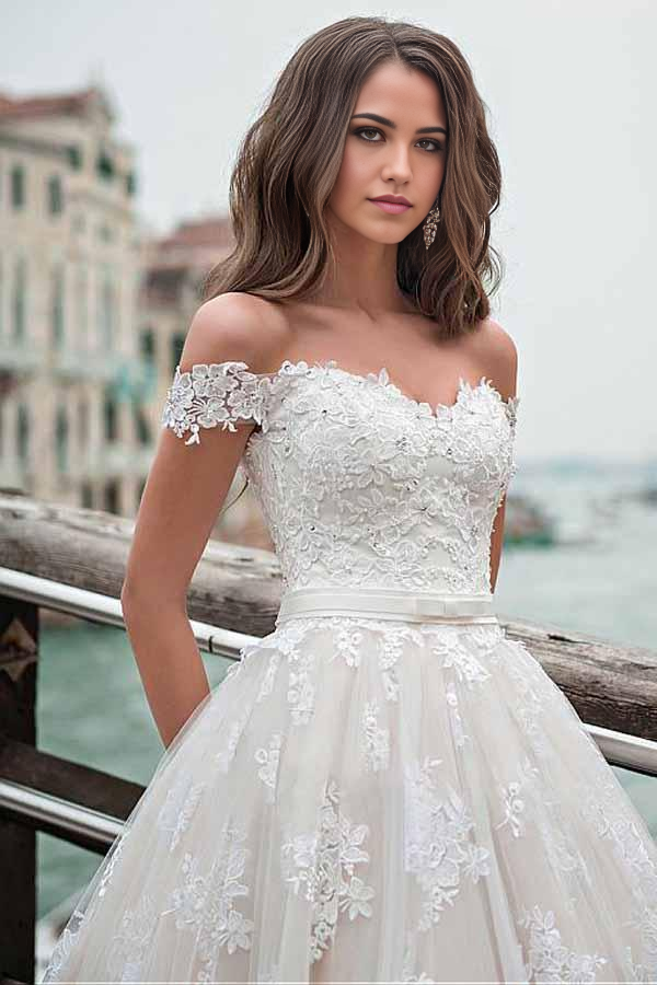 Back view of the A-line wedding dress, showcasing the flowing skirt and lace embellishments.