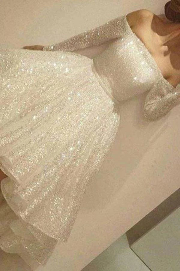 Woman wearing an elegant A-line off-shoulder asymmetrical maxi dress.