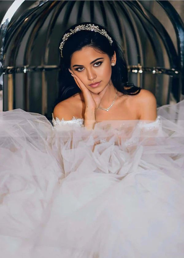 Elegant A-line off-shoulder beaded ball gown wedding dress with a long train.