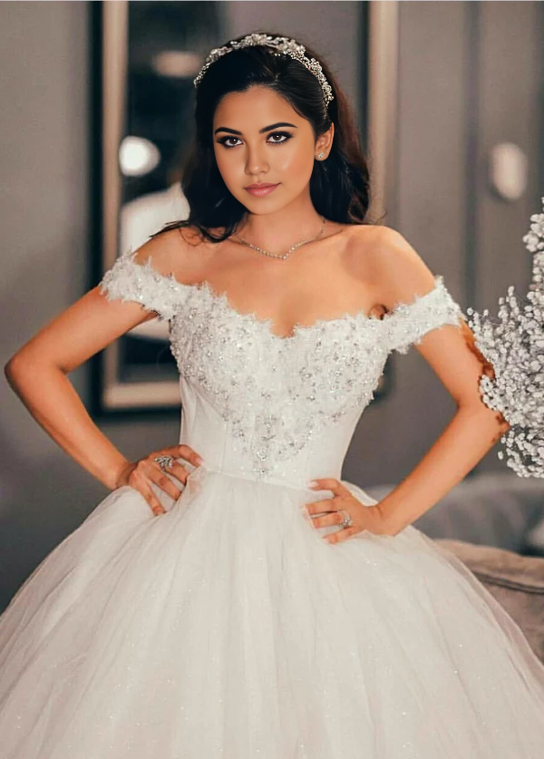 Side view of the A-line off-shoulder wedding dress, showcasing the beading and silhouette.