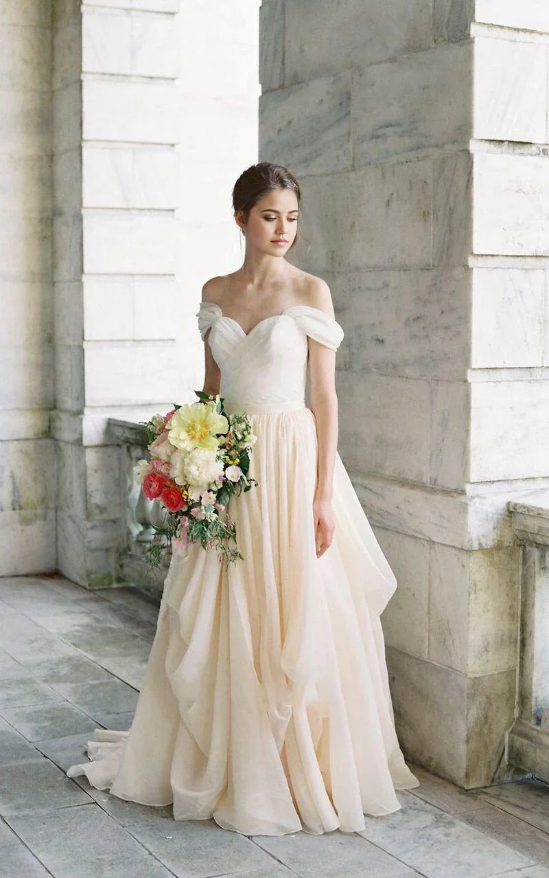 Full view of a floor-length A-line off-shoulder gown, featuring a V-neck and short sleeves.