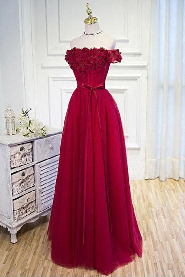 Light blue A-line off-shoulder prom dress with floral appliques.
