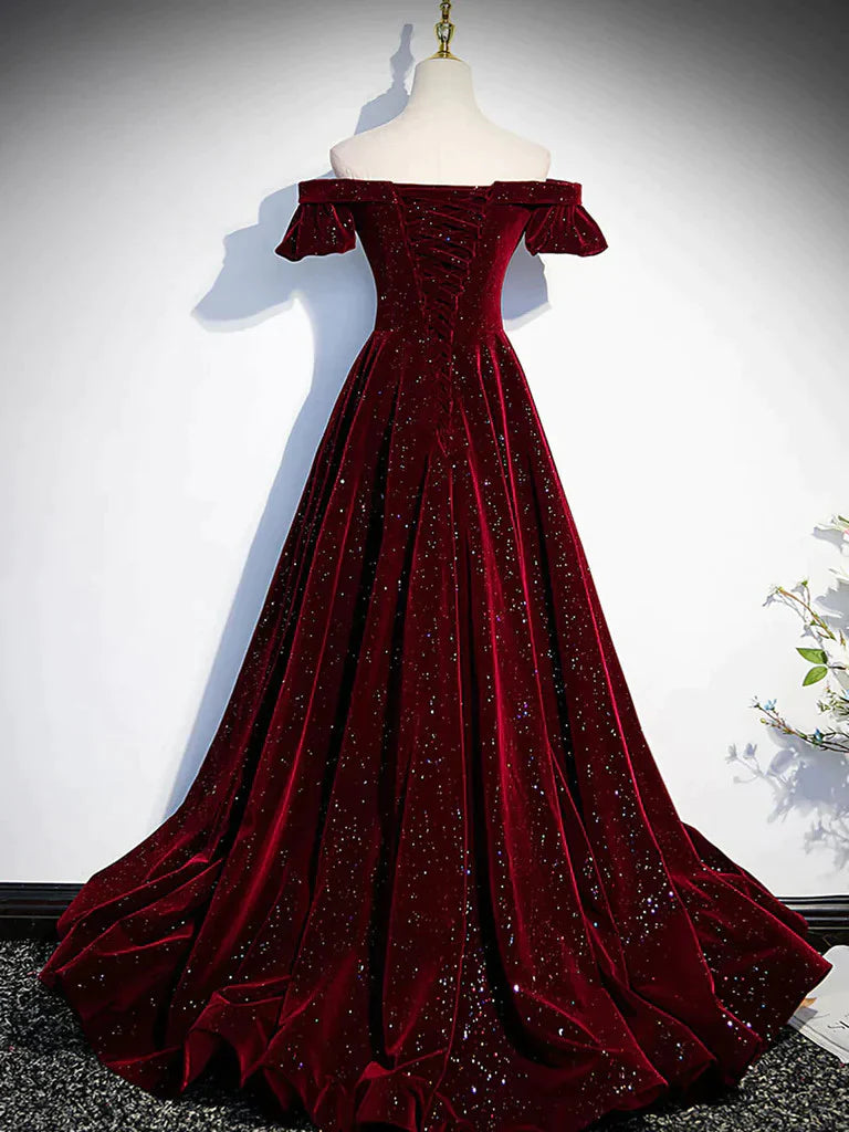 Back view of an A-line off-shoulder long prom dress on a model.