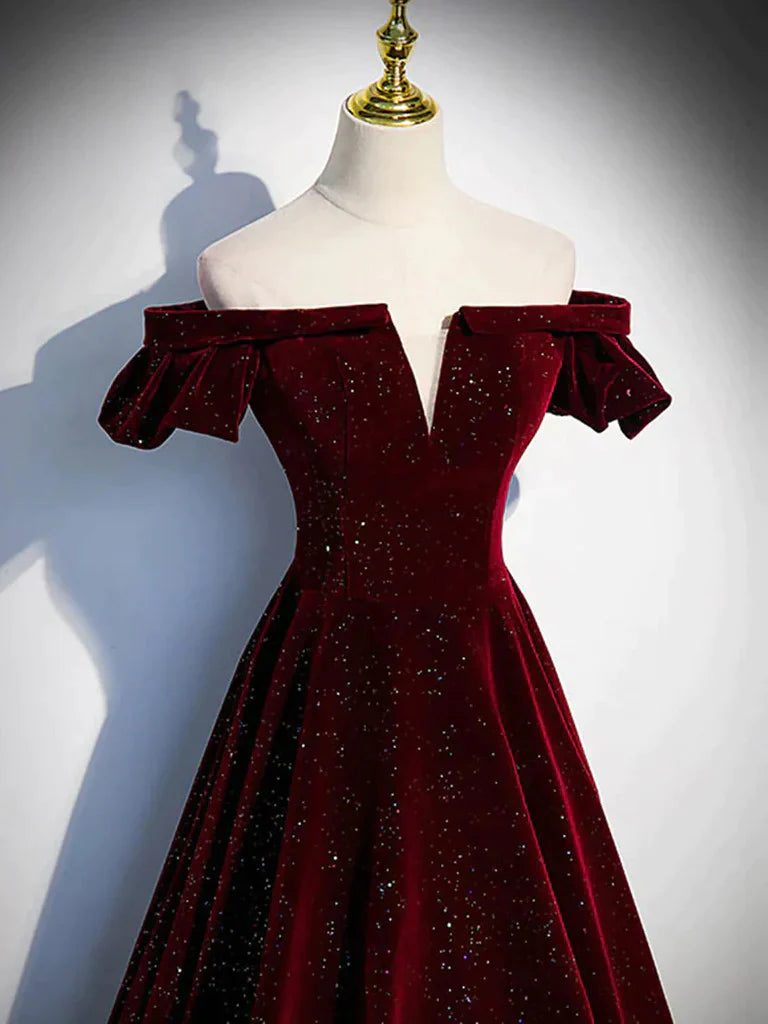 Side view of an A-line off-shoulder long prom dress on a model.