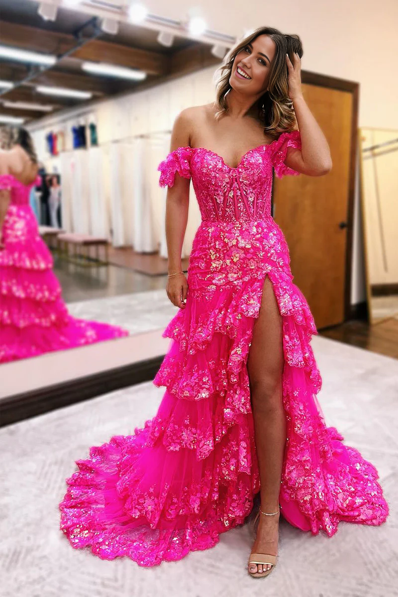 Fuchsia sequin A-line prom dress with off-shoulder neckline, ruffle tiers, and a side slit.