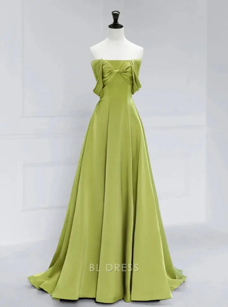 Elegant green satin A-line off-shoulder long formal dress worn by a woman.