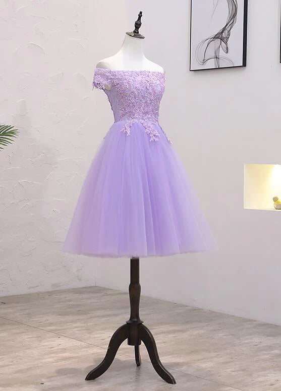 Side view of an elegant off-shoulder A-line dress with lace and tulle.