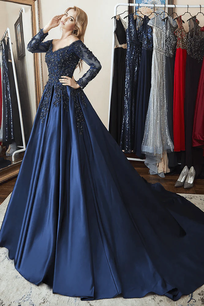 Close-up of the intricate beading on the navy blue off-shoulder long sleeve dress.