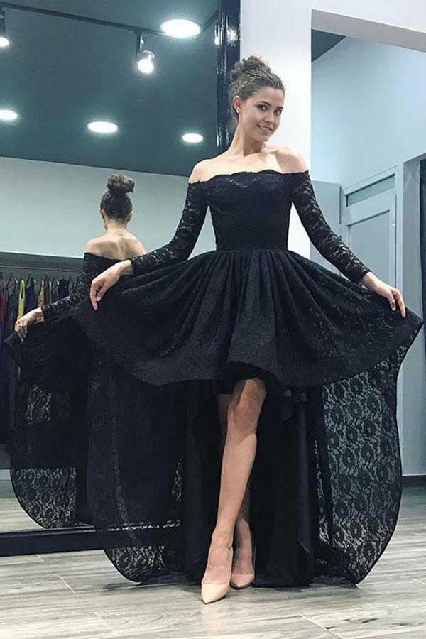 Model wearing an A-line off-the-shoulder pink lace high-low prom dress with long sleeves.