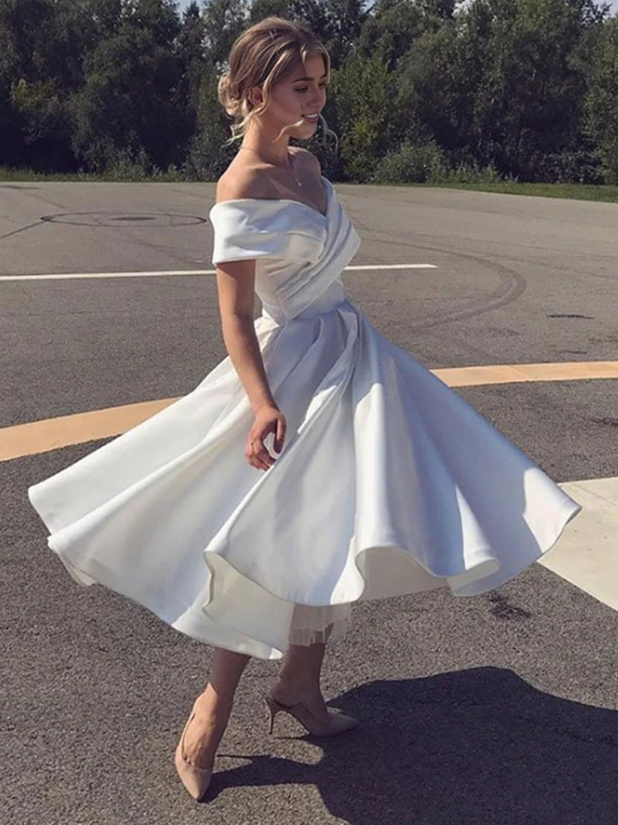 A-line off-shoulder satin tea length wedding dress from a different angle.