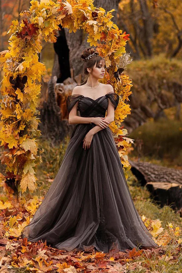 Elegant A-line off-shoulder black wedding dress with a flowing skirt, perfect for a forest-themed ceremony.