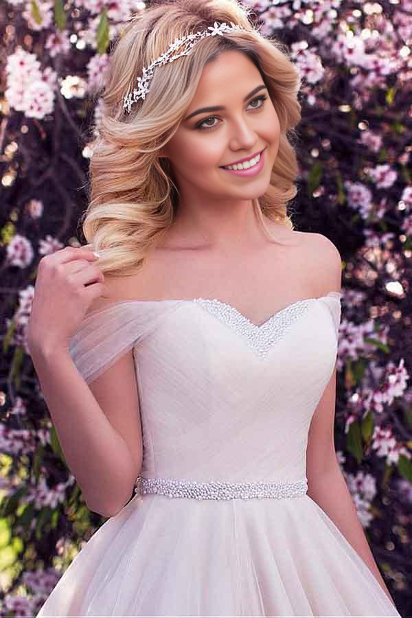 Close-up of the beaded bodice and delicate tulle neckline on the wedding dress.