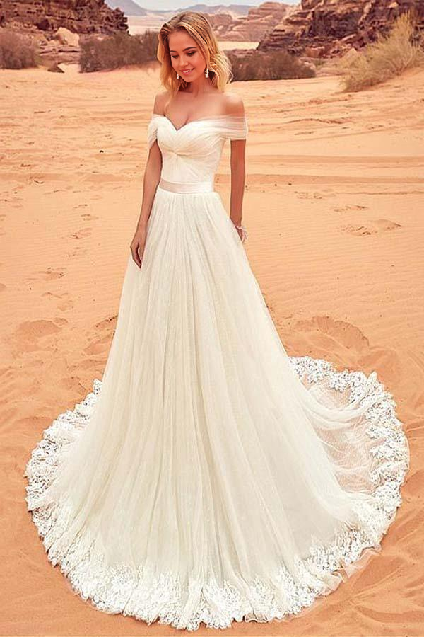 Elegant A-line wedding dress with off-shoulder lace neckline and tulle skirt.