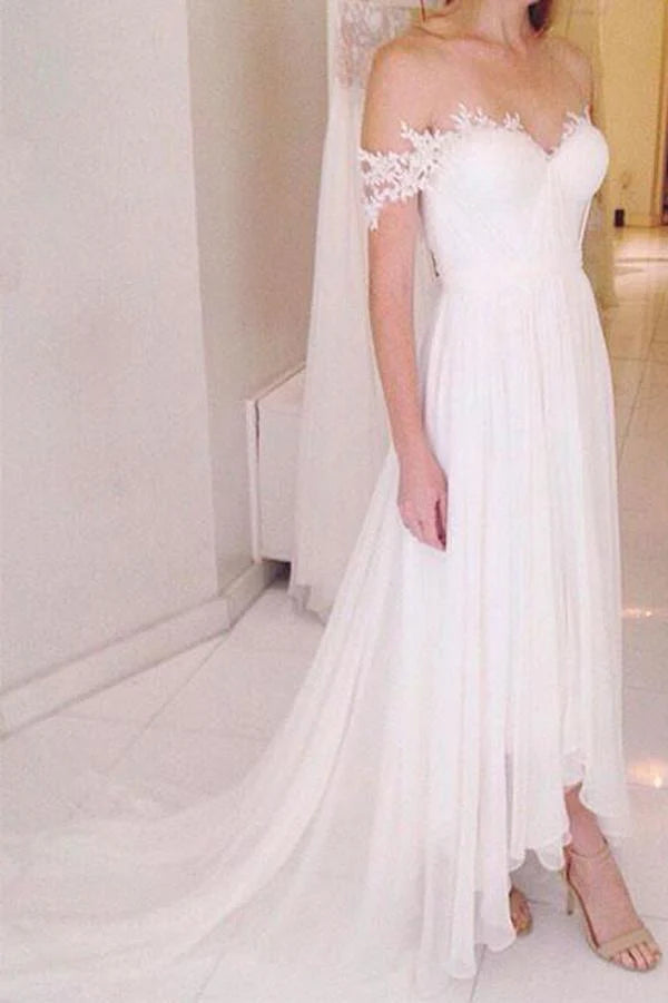White A-line off-shoulder wedding dress with delicate lace bodice and flowing tulle skirt.