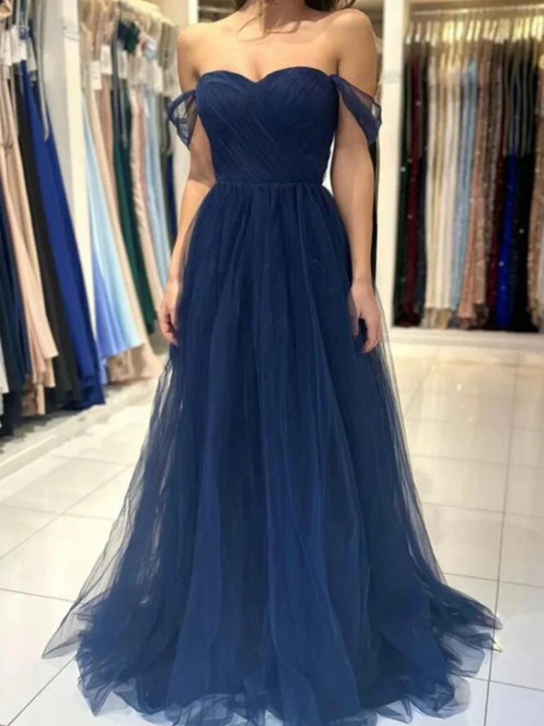 Model wearing an elegant A-line off-shoulder tulle long prom dress.