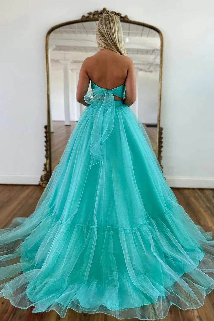 Full view of a unique mint green A-line off-shoulder tulle prom dress.