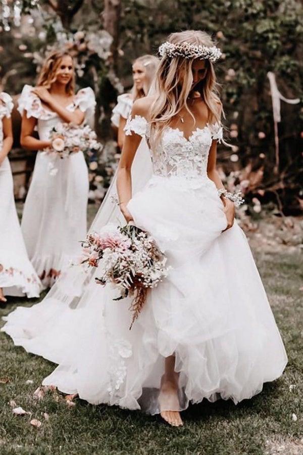 Elegant white A-line off-shoulder ball gown wedding dress with delicate applique.