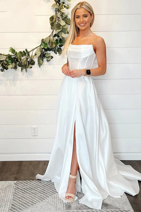 Elegant white A-line off-shoulder wedding dress with a thigh-high slit.