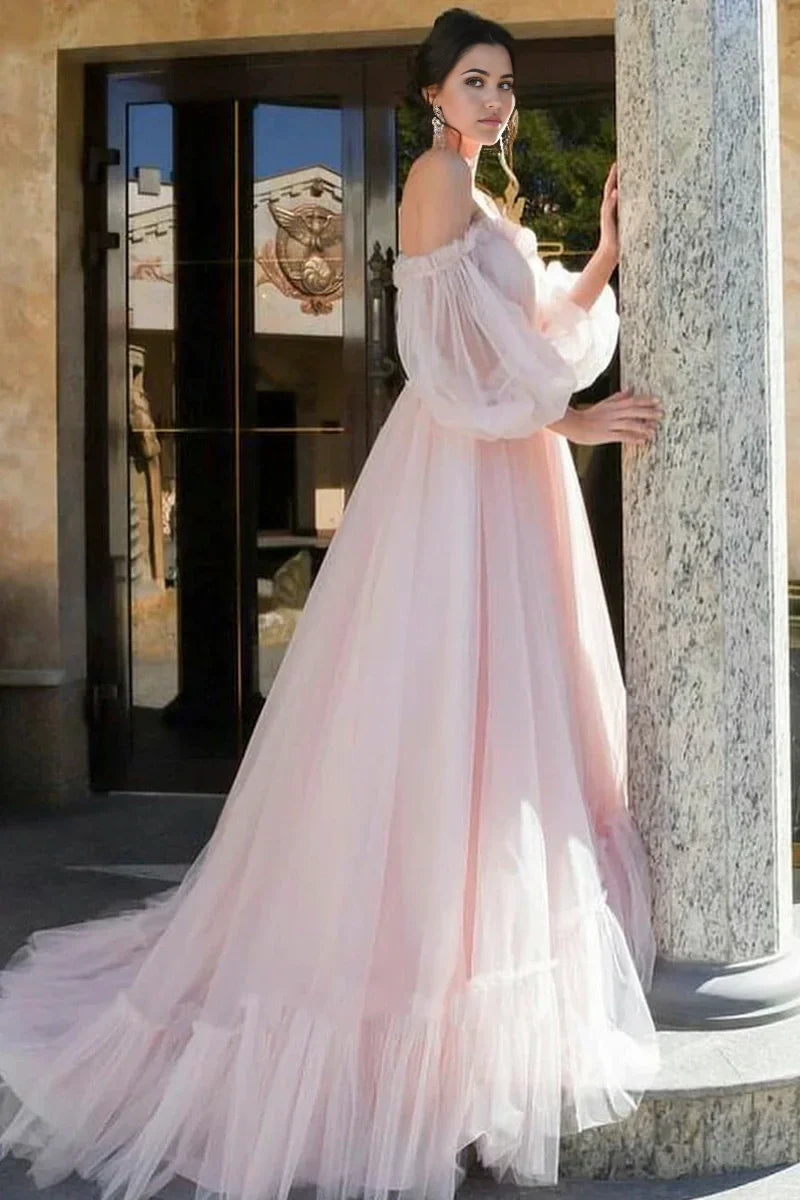 Close-up of off-shoulder sweetheart neckline on tulle wedding gown.