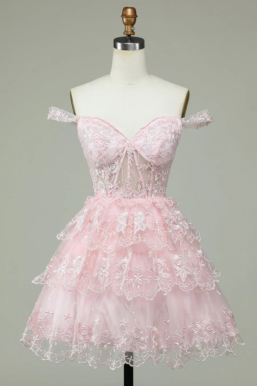 Blush pink A-line off-the-shoulder homecoming dress with appliques.
