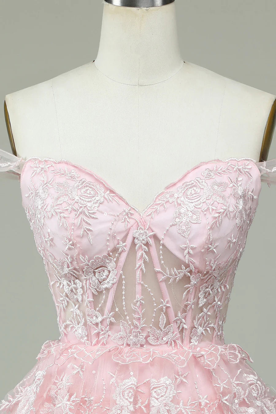 Close-up of appliques and multi-layered skirt on homecoming dress.